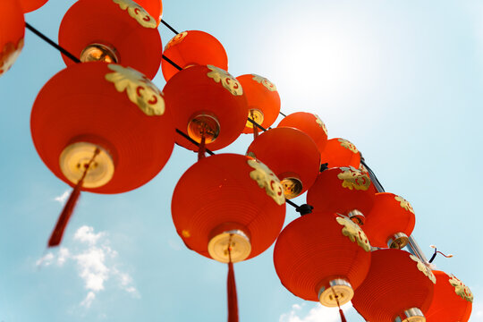 Festive Red Chinese Lanterns Against Blue Sky