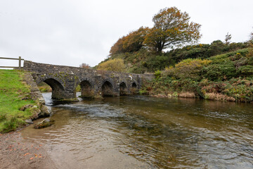 Fototapeta premium The autumn colours at Landacre bridge in Exmoor national Park