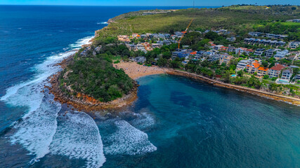 Fototapeta premium Aerial View of Manly Beach and Sydney harbour with manly houses on a warm summer day blue skies Sydney NSW Australia