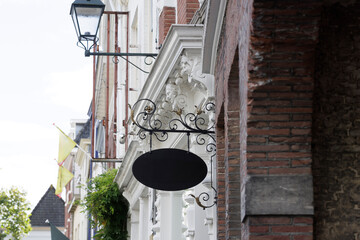 Blank sign for copyspace hanging above a shop. 