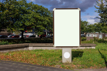 Blank billboard / advertising column on the street.
