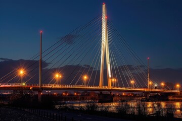 Obraz premium A serene scene of a bridge with lights shining down onto the calm waters below