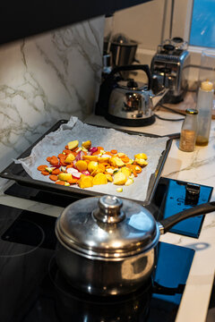 Woman preparing dinner in modern kitchen