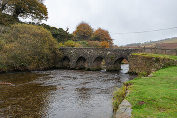 Fototapeta premium The autumn colours at Landacre bridge in Exmoor national Park