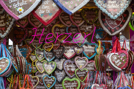 Gingerbread Hearts shop at the Oktoberfest 24 in Munich with neon sign