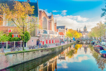 Naklejka premium Church of St Nicholas, old town canal, at sunny spring day, Amsterdam, Holland