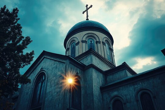 A picture of a church with a cross on its roof