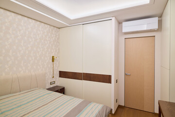 Contemporary Bedroom Interior Featuring a Sleek and Stylish Design with Air Conditioning