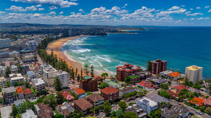 Aerial View of Manly Beach and Sydney harbour with manly houses on a warm summer day blue skies...