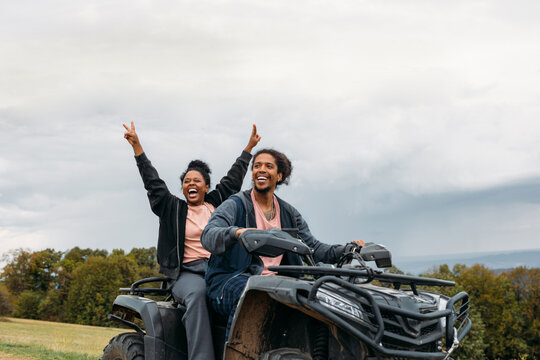 Couple driving quad