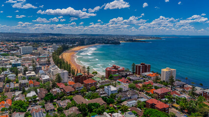 Fototapeta premium Aerial View of Manly Beach and Sydney harbour with manly houses on a warm summer day blue skies Sydney NSW Australia
