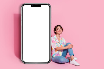 Full size photo of pretty young lady empty space smart phone screen isolated on pink color background