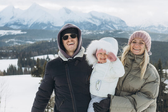 Happy family portrait on winter vacation