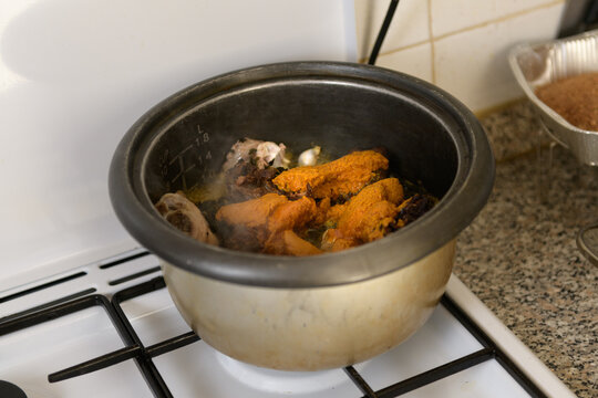 Pot with cooking typical nigerian Banga Soup 