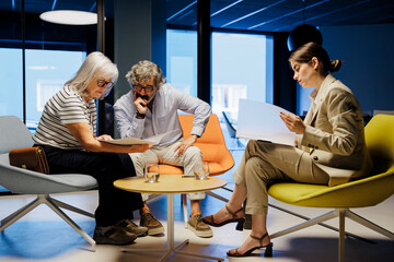 Financial advisor showing investment strategy to senior couple
