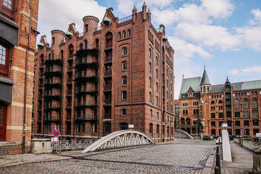 Historic brick warehouses and cobblestone streets in Hamburg Speichers