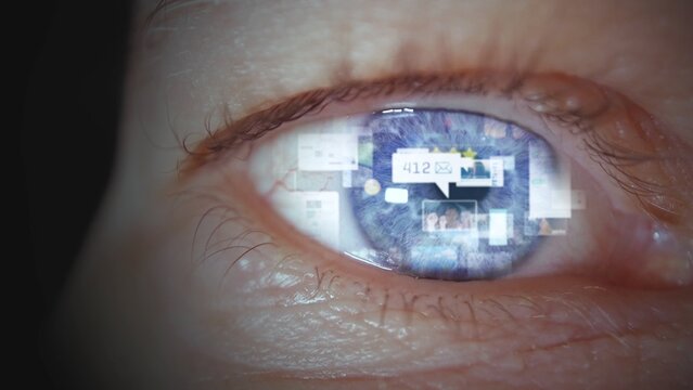 Young man's eye with graphic of social media icons. Addiction and health issue problem using modern technology