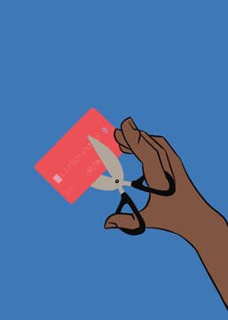 Hand using scissors to cut credit cards