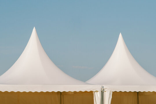 Laconic white tents at a summer festival