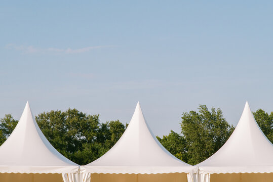 Laconic white tents at a summer festival