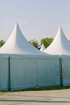 Laconic white tents at a summer festival