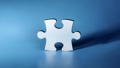 A single puzzle piece is placed on a solid colored surface