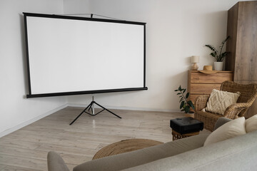 Interior of light room with projector screen and armchair