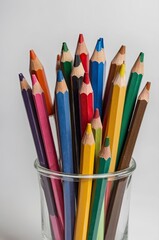 Fototapeta premium Colored pencils on white background. Close-up. Flatlay. Copy space 