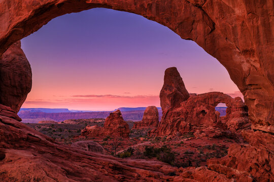 A sunrise  view of turret arch through the north window in arches