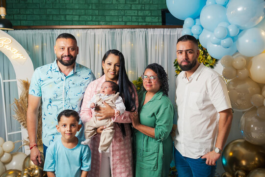 Portrait of a family in a baptism party