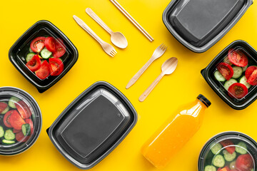 Tomatoes salad for lunch in plastic container ready for delivery, top view