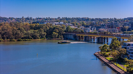 Obraz premium Panorama Aerial view above Rhodes with views to Meadowbank and Olympic park and Wentworth Point and Concord West with Parramatta River in Sydney NSW Australia