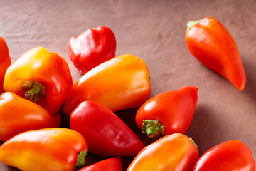 Fresh Organic Bell Peppers in Farm-to-Table on Brown Clay Surface