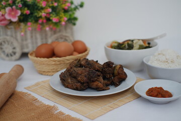 traditional Indonesian food arranged neatly on a white surface