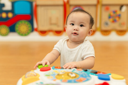 Adorable Baby Playing with Colorful Educational Toy