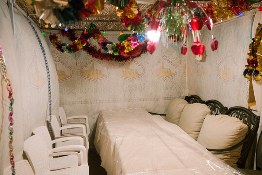 Sukkah Interior With Table Set For Guests During Sukkot