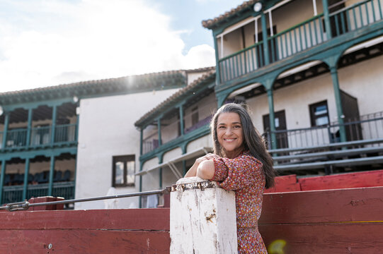 Satisfied woman tourist in historic bullring
