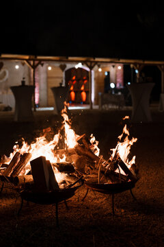 Wood burning in a brazier in a garden