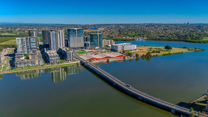 Naklejka premium Panorama Aerial view above Rhodes with views to Meadowbank and Olympic park and Wentworth Point and Concord West with Parramatta River in Sydney NSW Australia