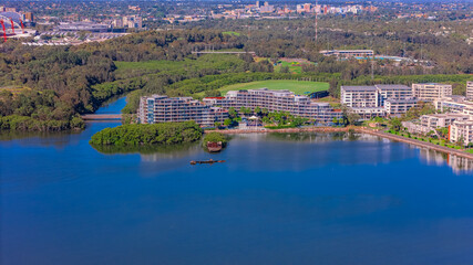 Fototapeta premium Panorama Aerial view above Rhodes with views to Meadowbank and Olympic park and Wentworth Point and Concord West with Parramatta River in Sydney NSW Australia