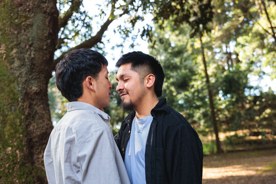 Two young gay men getting romantically close