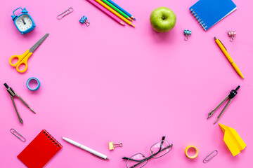 Frame of stationery and school supplies on student desk, top view. Education concept