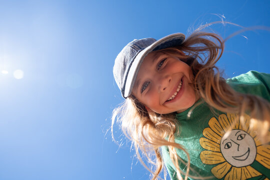 A cute little girl with her head in the sky