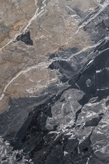 Close-up Grey marble Breche de aubisque Texture with Veins in High Resolution. Elegant marble for Wallpaper and 3D Models. Luxury stone Background for Design Projects