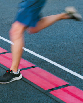 A runner crosses the finish line 