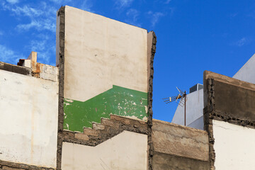 demolition background, side walls of a residential building with traces of floors and stair
