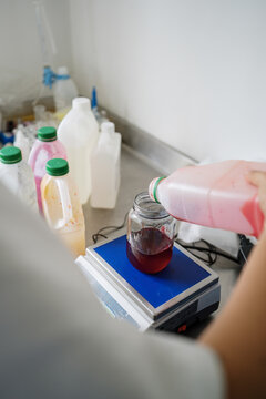 Scientist weighs food coloring on a scale