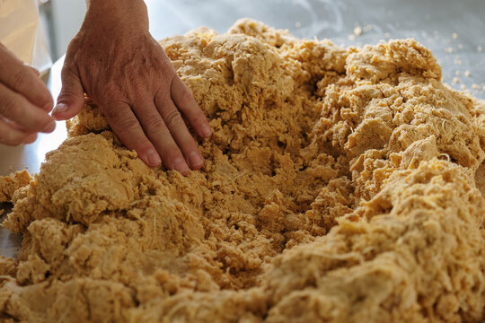 Man kneading dulce de leche