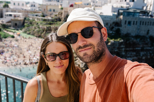 Selfie of a couple vacationing in Polignano a Mare, Italy
