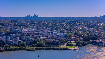 Obraz premium Panorama Aerial view above Rhodes with views to Meadowbank and Olympic park and Wentworth Point and Concord West with Parramatta River in Sydney NSW Australia